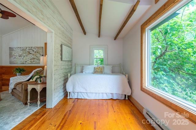 528 Padgettown Rd, Black Mountain, NC 28711 - bedroom with a baseboard radiator, wooden walls, light wood-type flooring, and beam ceiling