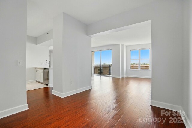 1315 E Blvd Unit 611, Charlotte, NC 28203 - spare room featuring wood finished floors and baseboards