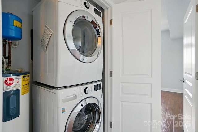 1315 E Blvd Unit 611, Charlotte, NC 28203 - laundry room featuring electric water heater, stacked washing machine and dryer, and wood finished floors