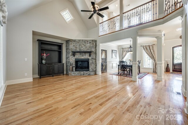 546 Little Cove Ln, Lake Wylie, SC 29710 - living area with healthy amount of natural light, high vaulted ceiling, ceiling fan, ornate columns, and wood finished floors