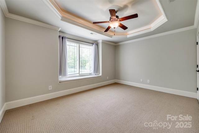 546 Little Cove Ln, Lake Wylie, SC 29710 - carpeted empty room featuring a tray ceiling, a ceiling fan, ornamental molding, and baseboards