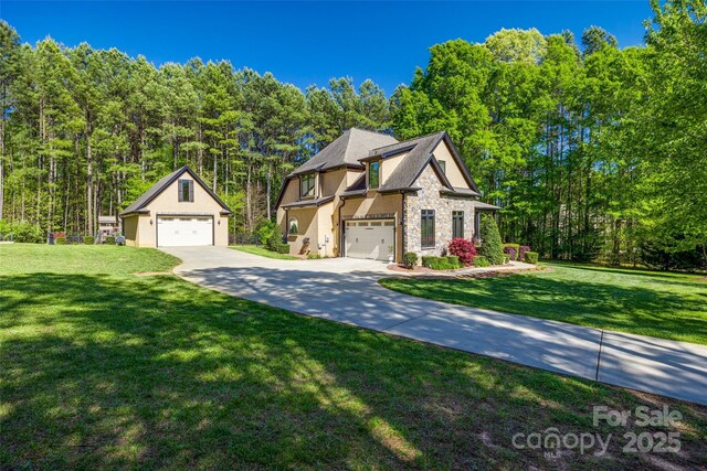 546 Little Cove Ln, Lake Wylie, SC 29710 - view of front facade featuring a garage, a front lawn, stone siding, and stucco siding