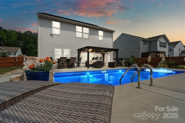 3092 Riker St, Clover, SC 29710 - pool at dusk featuring a patio area, a gazebo, a fenced backyard, outdoor dining space, and an outdoor living space
