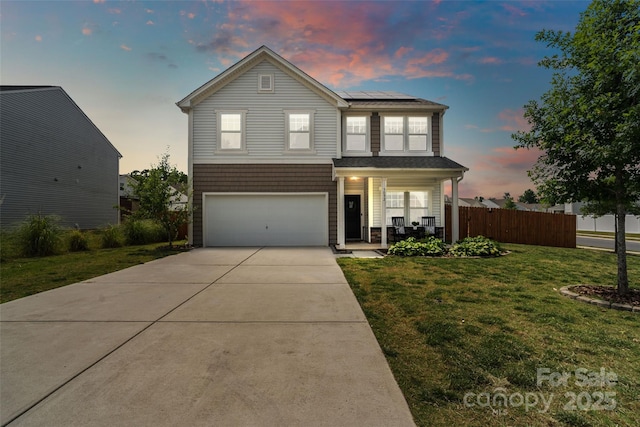 3092 Riker St, Clover, SC 29710 - traditional-style home featuring covered porch, roof mounted solar panels, a garage, and driveway