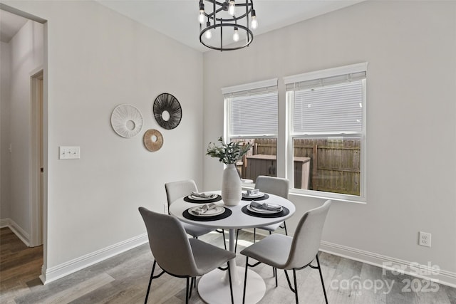 3092 Riker St, Clover, SC 29710 - dining space with a chandelier, baseboards, and wood finished floors