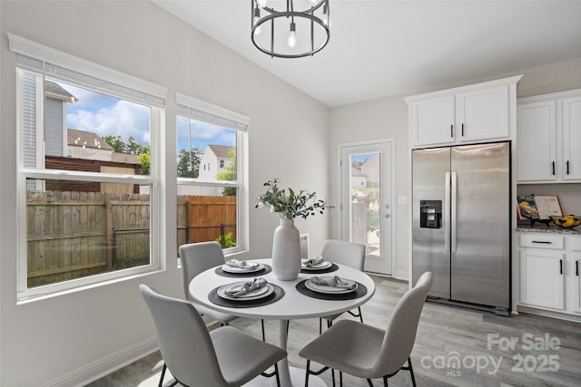 3092 Riker St, Clover, SC 29710 - dining room with a chandelier, light wood finished floors, and baseboards