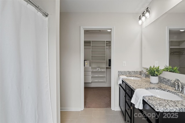 3092 Riker St, Clover, SC 29710 - full bathroom featuring a walk in closet, double vanity, tile patterned flooring, and baseboards