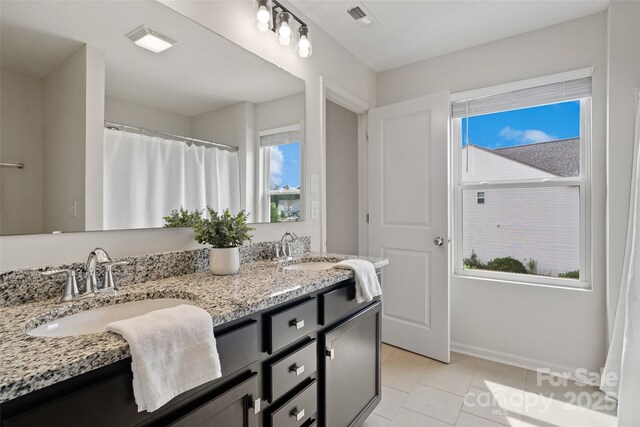 3092 Riker St, Clover, SC 29710 - bathroom featuring double vanity, tile patterned floors, and baseboards