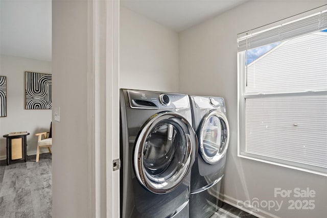 3092 Riker St, Clover, SC 29710 - laundry room featuring washing machine and dryer, baseboards, and wood finished floors