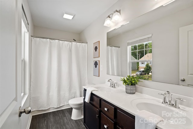 3092 Riker St, Clover, SC 29710 - full bath with double vanity, toilet, wood finished floors, and shower / bath combo