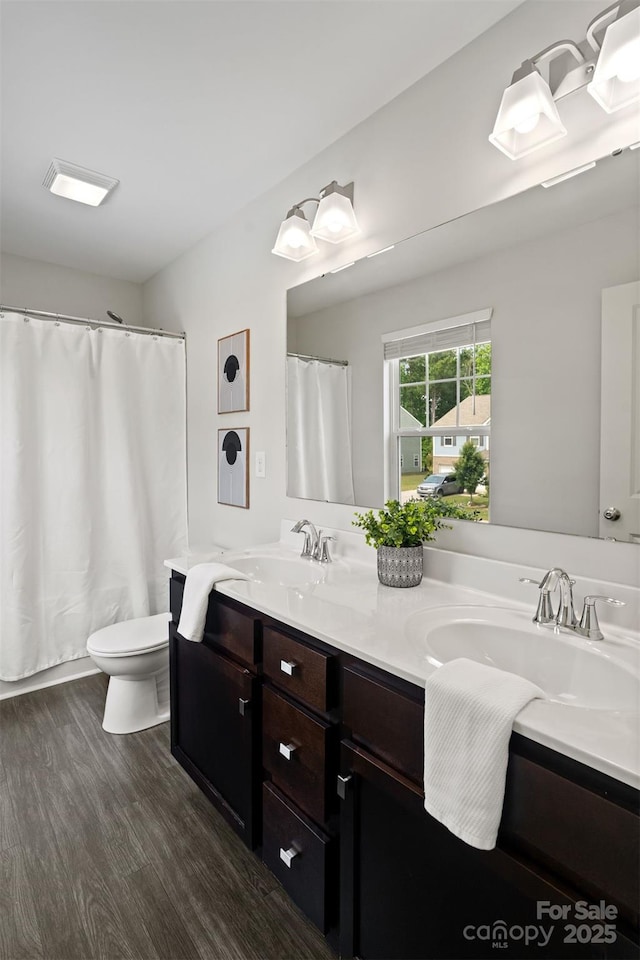 3092 Riker St, Clover, SC 29710 - bathroom with double vanity, toilet, wood finished floors, and curtained shower