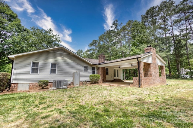 2434 Olewoods Ct, Rock Hill, SC 29732 - back of property featuring a chimney, ceiling fan, a lawn, cooling unit, and a patio