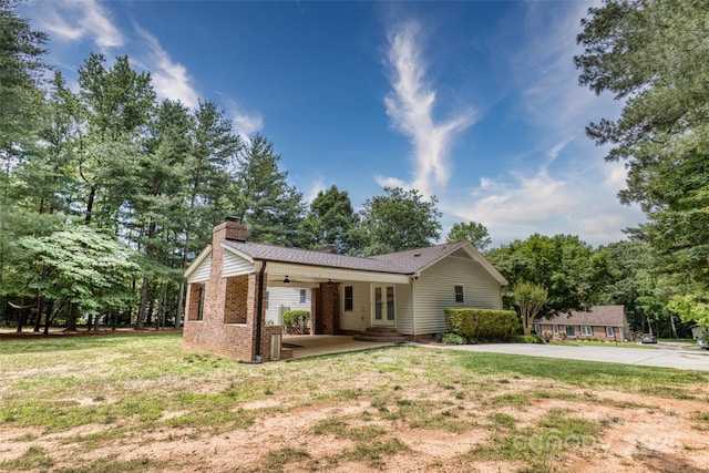 2434 Olewoods Ct, Rock Hill, SC 29732 - single story home with a chimney, a front yard, brick siding, french doors, and a patio