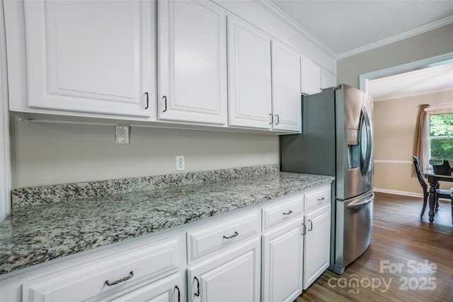 2434 Olewoods Ct, Rock Hill, SC 29732 - kitchen with stainless steel fridge with ice dispenser, white cabinets, ornamental molding, dark wood-style flooring, and light stone counters