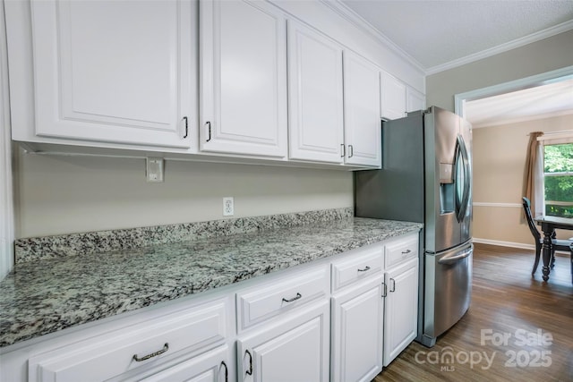 2434 Olewoods Ct, Rock Hill, SC 29732 - kitchen with stainless steel fridge with ice dispenser, white cabinetry, crown molding, dark wood-type flooring, and light stone counters