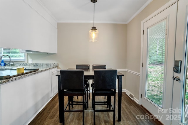 2434 Olewoods Ct, Rock Hill, SC 29732 - dining area featuring dark wood-style flooring, crown molding, and baseboards