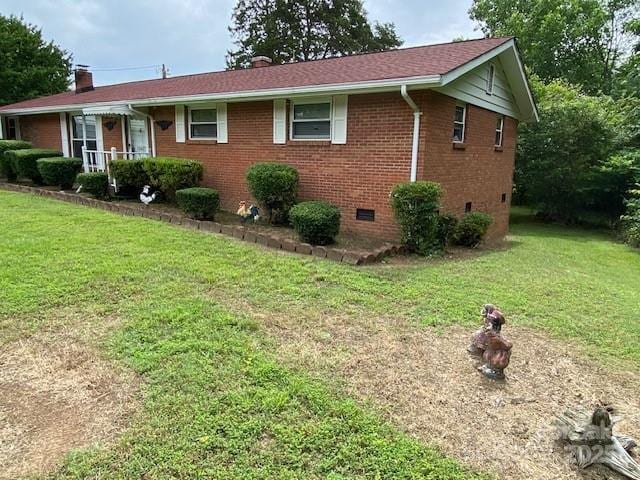 13427 Homewood Dr, Charlotte, NC 28262 - single story home with crawl space, brick siding, a chimney, and a front lawn