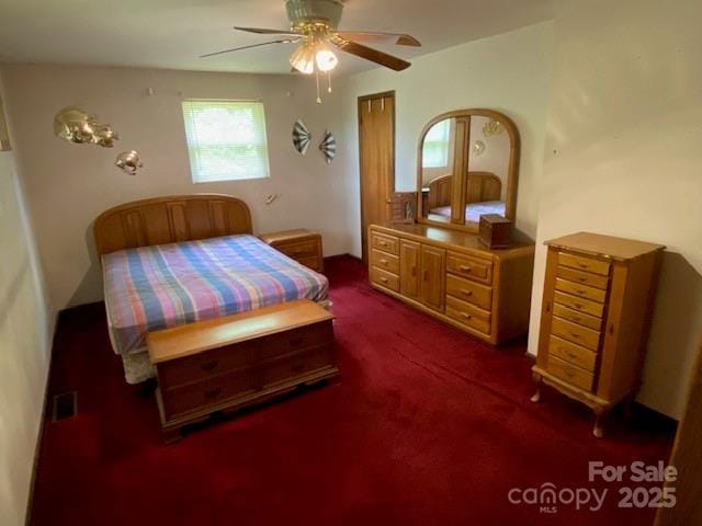 13427 Homewood Dr, Charlotte, NC 28262 - bedroom with multiple windows, dark carpet, and ceiling fan