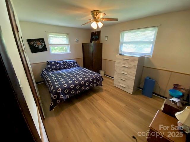 13427 Homewood Dr, Charlotte, NC 28262 - bedroom featuring light wood finished floors and a ceiling fan