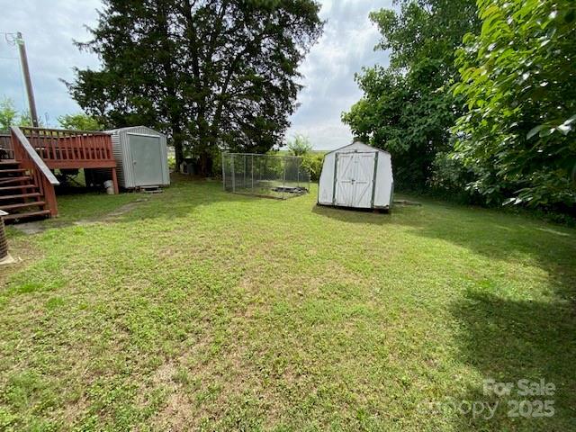 13427 Homewood Dr, Charlotte, NC 28262 - view of yard with stairway and a deck