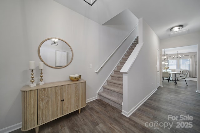 240 Briana Marie Way, Indian Trail, NC 28079 - stairway with wood finished floors, a chandelier, and baseboards