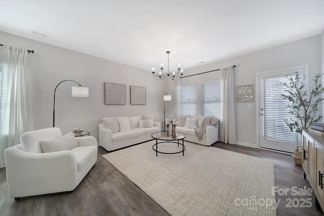 240 Briana Marie Way, Indian Trail, NC 28079 - living area with dark wood-style floors, a chandelier, and baseboards