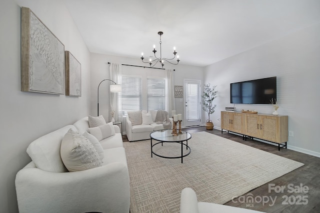 240 Briana Marie Way, Indian Trail, NC 28079 - living room featuring a chandelier, wood finished floors, and baseboards