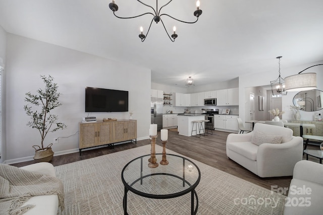 240 Briana Marie Way, Indian Trail, NC 28079 - living room featuring a chandelier, dark wood finished floors, and baseboards