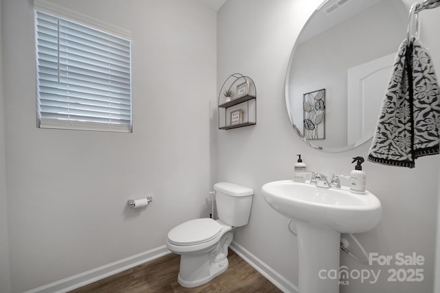 240 Briana Marie Way, Indian Trail, NC 28079 - half bathroom with wood finished floors, toilet, and baseboards