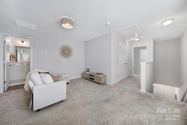 240 Briana Marie Way, Indian Trail, NC 28079 - sitting room featuring attic access, carpet floors, baseboards, and an upstairs landing