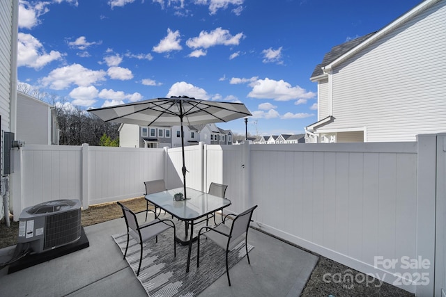 240 Briana Marie Way, Indian Trail, NC 28079 - fenced backyard with central AC unit, a patio area, and outdoor dining space
