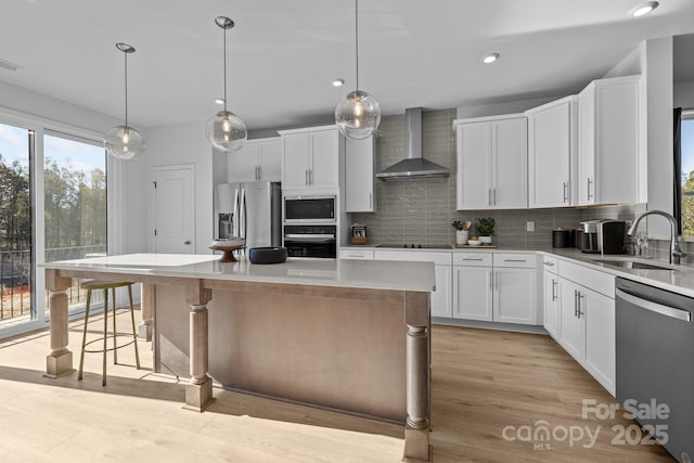 3236 Drift St Unit 58End, Charlotte, NC 28278 - kitchen with wall chimney range hood, stainless steel appliances, a sink, backsplash, and recessed lighting