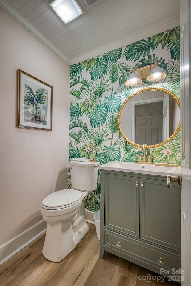 206 Independence Trl, Morganton, NC 28655 - bathroom with wallpapered walls, baseboards, toilet, vanity, and ornamental molding