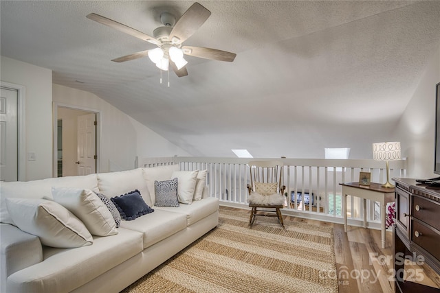 206 Independence Trl, Morganton, NC 28655 - living area featuring ceiling fan, lofted ceiling, light wood-style flooring, and a textured ceiling