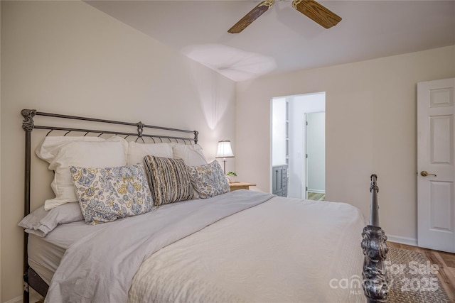 206 Independence Trl, Morganton, NC 28655 - bedroom featuring baseboards, wood finished floors, a ceiling fan, and ensuite bathroom