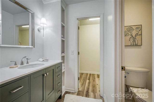206 Independence Trl, Morganton, NC 28655 - bathroom featuring toilet, wood finished floors, vanity, and baseboards