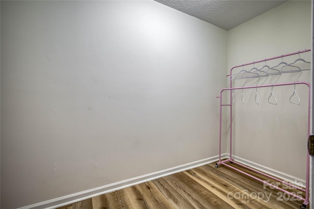 206 Independence Trl, Morganton, NC 28655 - empty room with wood finished floors, baseboards, and a textured ceiling