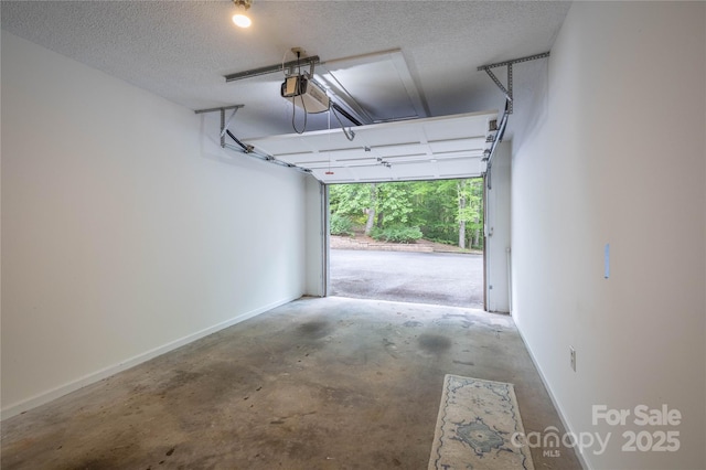 206 Independence Trl, Morganton, NC 28655 - garage featuring a garage door opener and baseboards