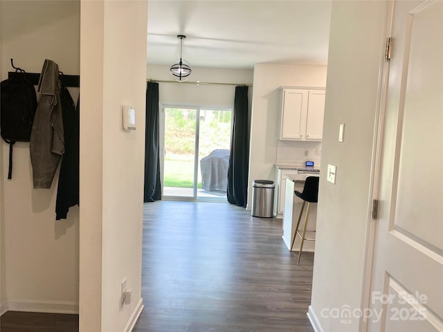 7024 Wheyfield Dr, Charlotte, NC 28215 - hall featuring dark wood-style flooring and baseboards
