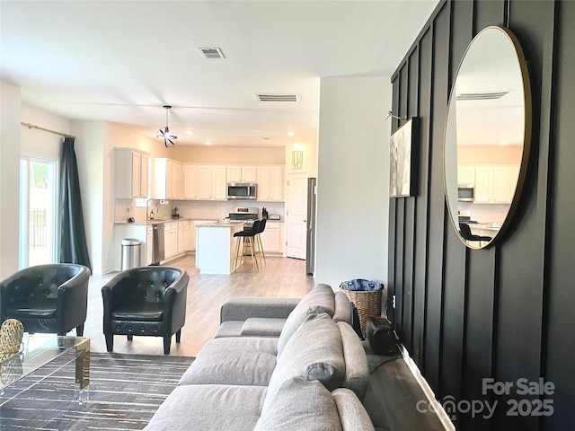 7024 Wheyfield Dr, Charlotte, NC 28215 - living area featuring light wood-type flooring