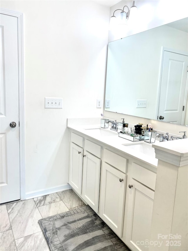 7024 Wheyfield Dr, Charlotte, NC 28215 - full bathroom featuring marble finish flooring, double vanity, and baseboards