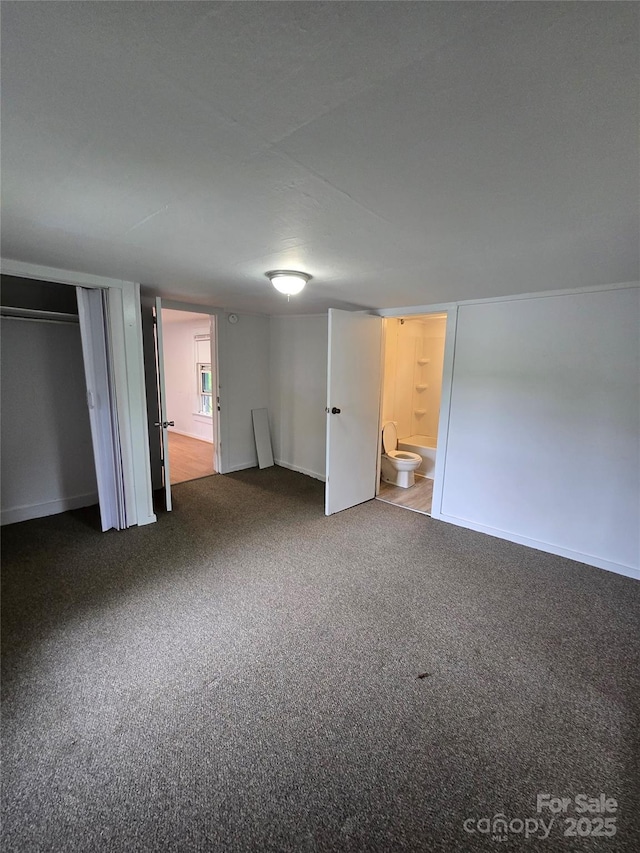 151 S Hill St, Waynesville, NC 28786 - unfurnished bedroom featuring carpet and baseboards