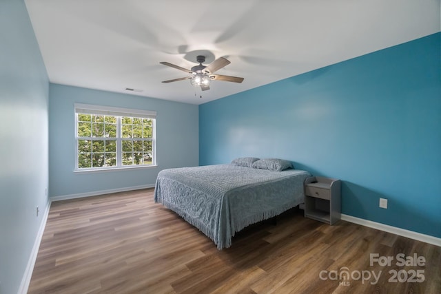 4002 Paddle Wheel Ln, Indian Trail, NC 28079 - bedroom with baseboards, wood finished floors, and a ceiling fan