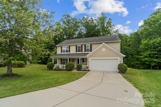 4002 Paddle Wheel Ln, Indian Trail, NC 28079 - view of front of house with covered porch, concrete driveway, a front lawn, and a garage