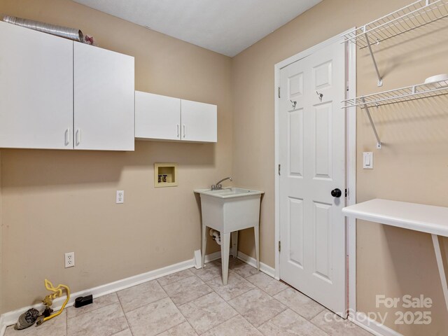 18 Westbridge Dr, Hendersonville, NC 28739 - laundry room with washer hookup, cabinet space, and baseboards