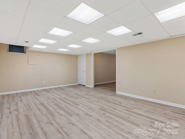 18 Westbridge Dr, Hendersonville, NC 28739 - unfurnished room with a drop ceiling, light wood-type flooring, and baseboards