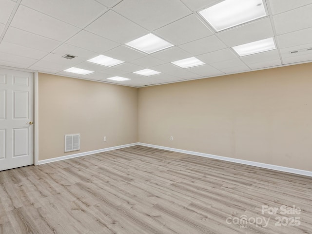 18 Westbridge Dr, Hendersonville, NC 28739 - spare room featuring light wood-style flooring, a paneled ceiling, and baseboards