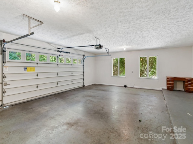 18 Westbridge Dr, Hendersonville, NC 28739 - garage featuring a garage door opener and baseboards