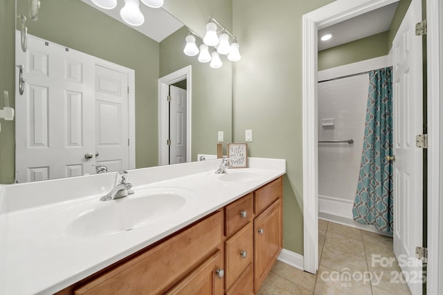 16714 Hammock Creek Pl, Charlotte, NC 28278 - bathroom featuring double vanity, tile patterned flooring, a shower with curtain, and baseboards