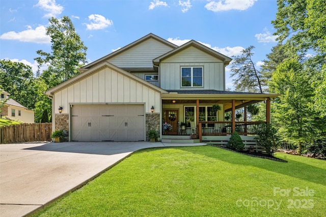 51 Cherry Ridge Ln, Weaverville, NC 28787 - view of front of property with covered porch, board and batten siding, concrete driveway, and an attached garage